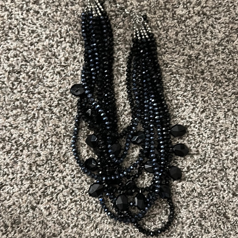 Necklace sparkler features layers of faceted glass beads all strung by hand